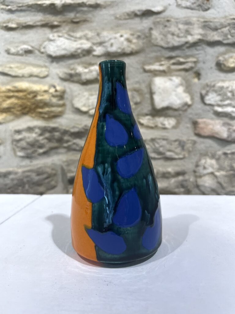 small green blue and orange small bottle