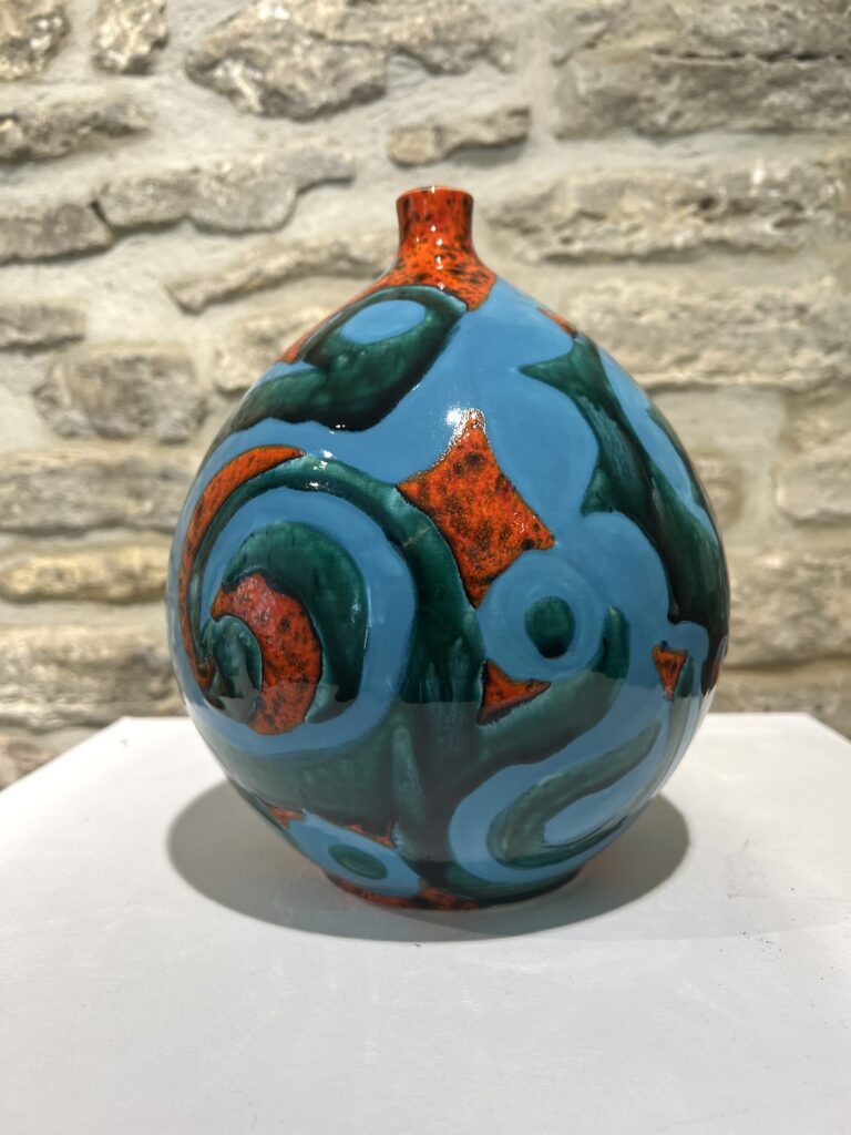 large turquoise and red round pot