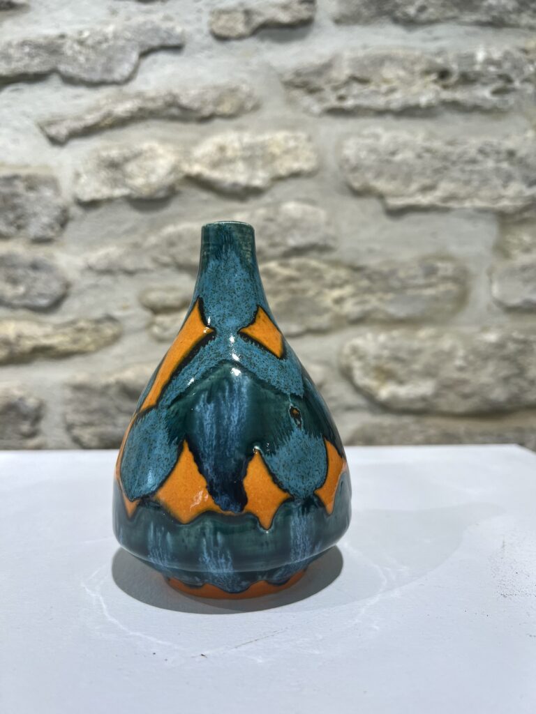 small turquoise and orange pot