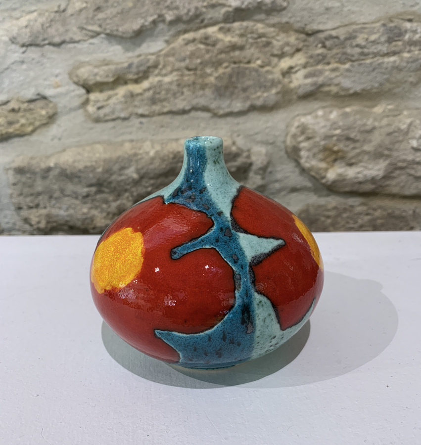 small red and turquoise pot